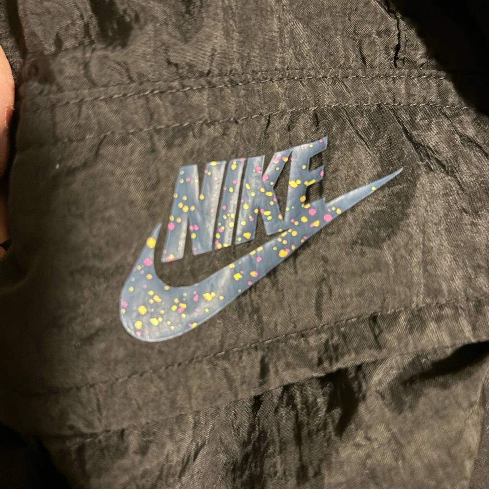 1990s Nike windbreaker pants with cargo pockets on both sides.
